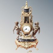 An ornate French gilt metal and marble Imperial mantel clock
