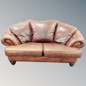A Chesterfield style two seater settee in brown buttoned leather