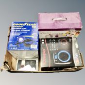 A box containing Sew-Lite sewing machine, a Goodyear portable vacuum cleaner,