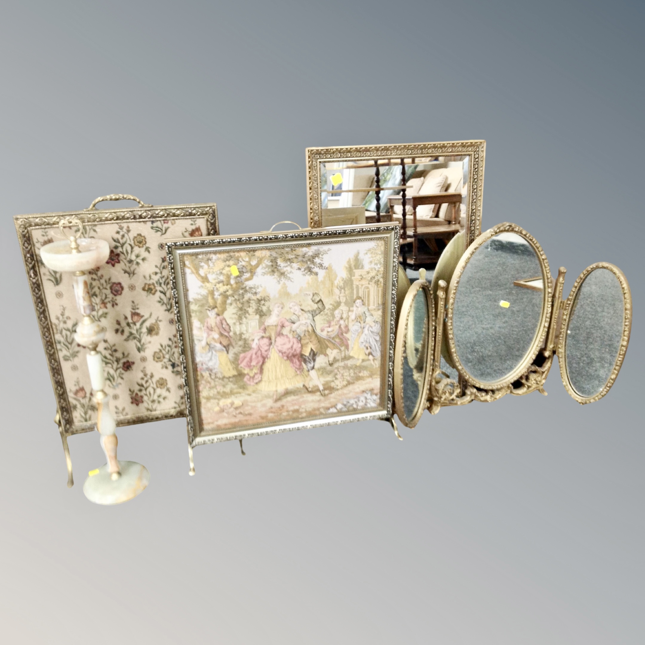 A gilt and onyx smoker's stand together with two gilt tapestry fire screens,