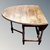 An oak gateleg table.
