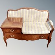 A French style inlaid telephone table fitted with two drawers and gilt metal mounts.