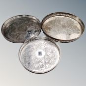 A set of three graduated silver plated circular gallery trays.