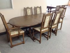 An Old Charm oval extending dining table fitted a leaf together with six chairs