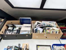 Two boxes containing photographs, postcards, cigarette cards in albums.
