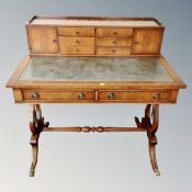 A Regency style mahogany lady's writing desk with understretcher.