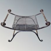 A contemporary wrought iron dressing table stool.