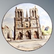 A vintage hand painted ceramic wall plaque / clock depicting Notre Dame