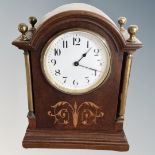 A late Victorian inlaid mahogany mantel clock