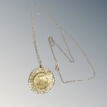 An 18ct yellow gold pendant with Greek style decoration suspended on 18ct yellow gold chain, 8.2g.