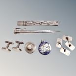 A collection of silver and white metal items to include pencil, needle case, cufflinks,