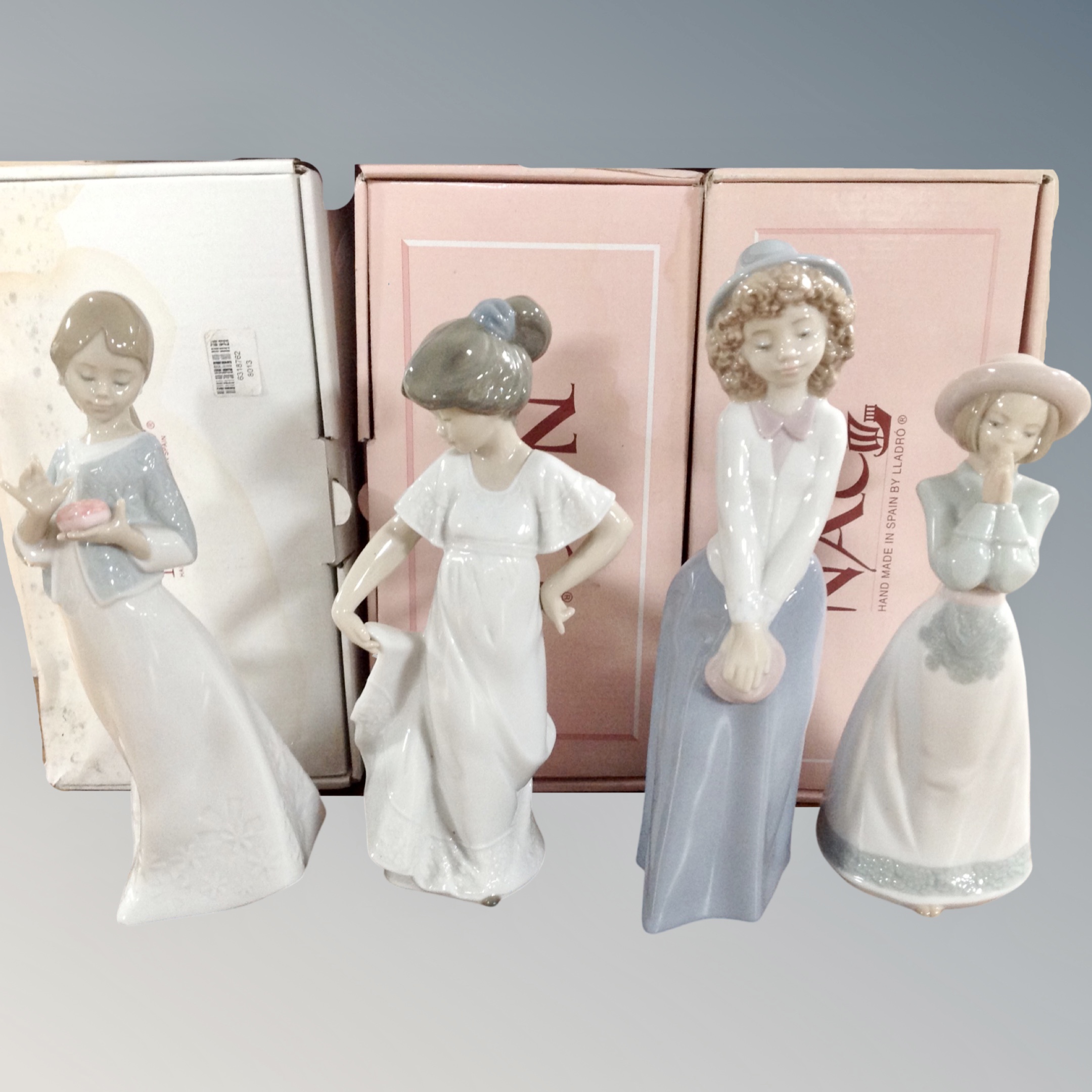 Four Nao figures - Too Cute, Gift from the Heart, Please Please and How Pretty, all boxed.