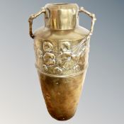 A brass embossed Art Nouveau vase,