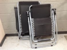 Two metal and canvas folding lounger chairs (un-used)