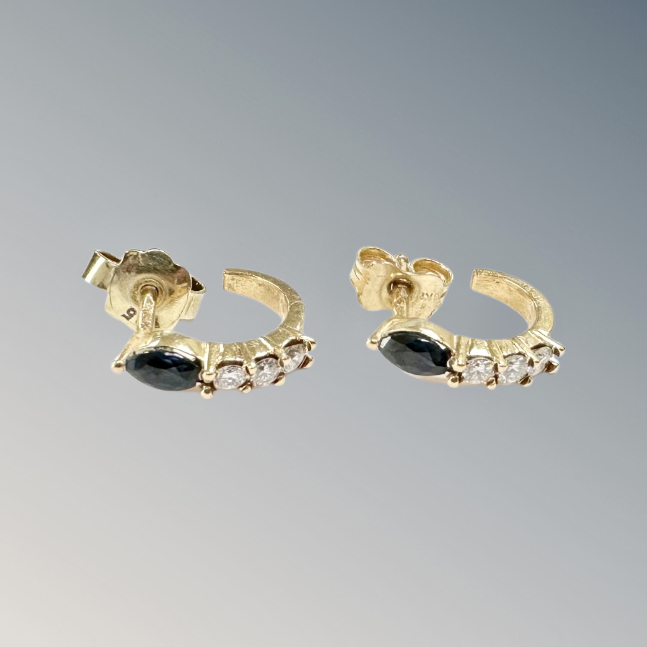 A pair of 18ct yellow gold earrings each set with marquis sapphire and brilliant cut diamonds, 2.1g.