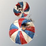 Two contemporary hanging figures of parachuting clowns