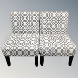 A pair of contemporary chairs in two-tone fabric