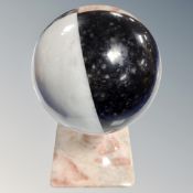 A four part specimen marble ball on marble stand
