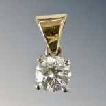 A solitaire diamond pendant set in 18ct yellow gold, approximately 0.35ct.