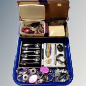 A tray of assorted costume jewellery, mourning brooch, cased set of six teaspoons,