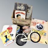 A box of assorted wall panels, tin signs and clocks bearing advertising, Popeye, Jack Daniels,