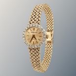 A lady's 9ct gold diamond-set Bueche-Girod wristwatch on 9ct gold integral bracelet