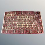 An Afghan/Caucasian prayer rug,