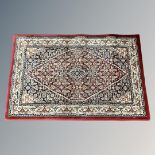 A machined rug of Persian design,