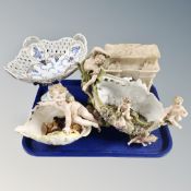 A tray of Continental cherub encrusted vases,