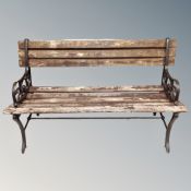 A wooden metal ended garden bench