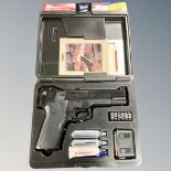 A Crosman 1008 Repeater .177 CO2 powered air pistol in case.