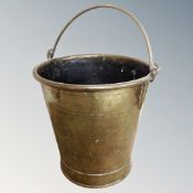 A 19th century brass swing-handled bucket