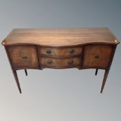 A Regency style serpentine fronted mahogany sideboard,