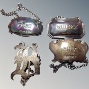 Three various silver decanter labels together with an unmarked brandy label