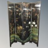 A Japanese style four fold screen decorated with butterflies