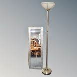 A contemporary uplighter together with a framed bevelled hall mirror