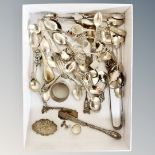 A box of continental silver and silver-plated teaspoons, silver whisky label, butter knife,