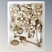 A box of continental silver and silver-plated teaspoons, silver whisky label, butter knife,