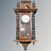 A 19th century mahogany cased eight day wall clock with brass and enamelled dial