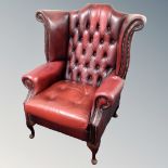 A Chesterfield oxblood leather armchair