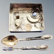A collection of white metal and silver items to include rings, enamelled fob,