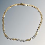 An 18ct three-tone gold necklace, diagonal block link design,