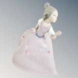 A Lladro figure of a girl in pink dress