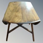 An Ercol elm drop leaf table