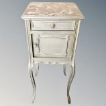 A contemporary painted bedside stand
