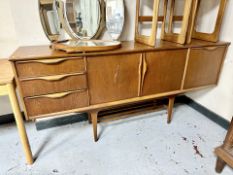 A mid century teak low sideboard,