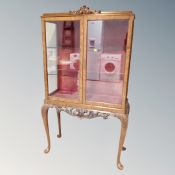 A 20th century walnut display cabinet,