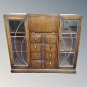 A 1920's oak bureau bookcase