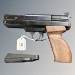 A BSA .22 air pistol with speed loader.