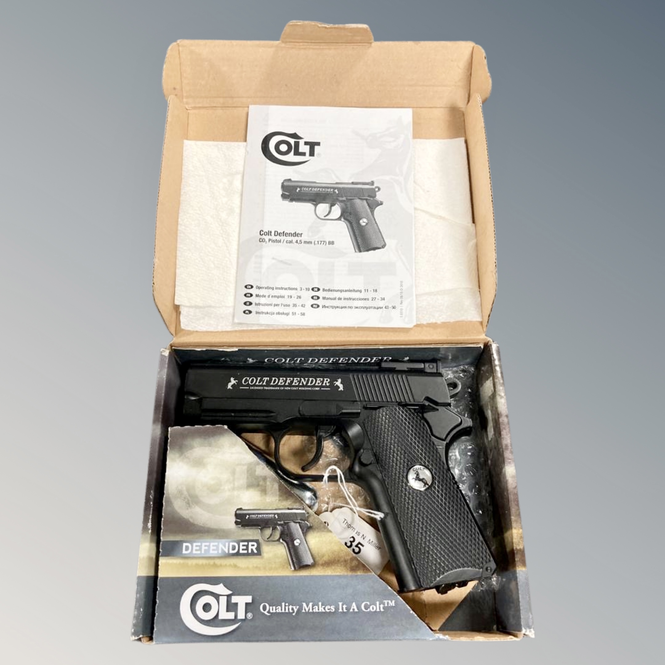 A Colt Defender .177 CO2 powered air pistol in original box with manual.